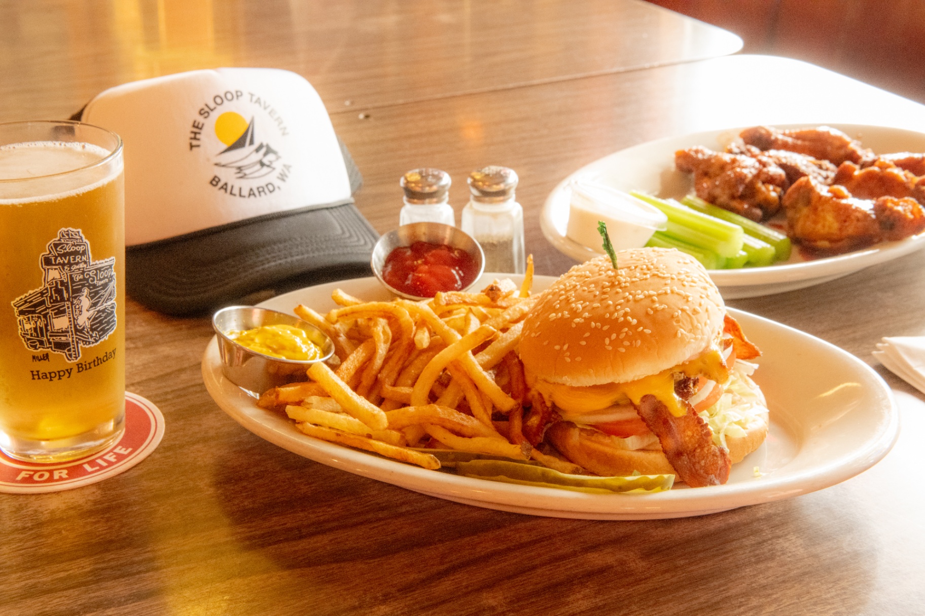 Burger, wings, and a cold beer with The Sloop Tavern trucker hat