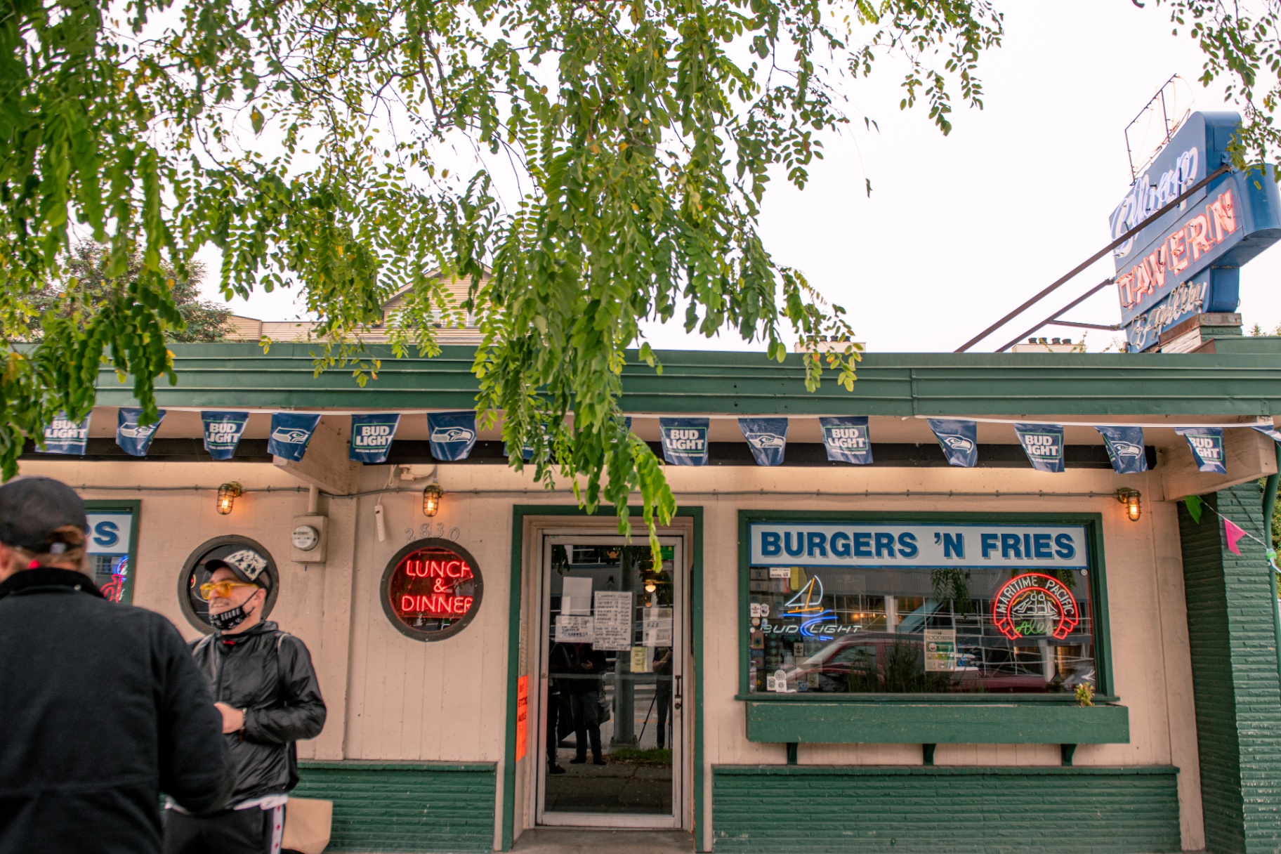 Front entrance with Bud Light Seahawks pennants and Burgers 'n Fries window