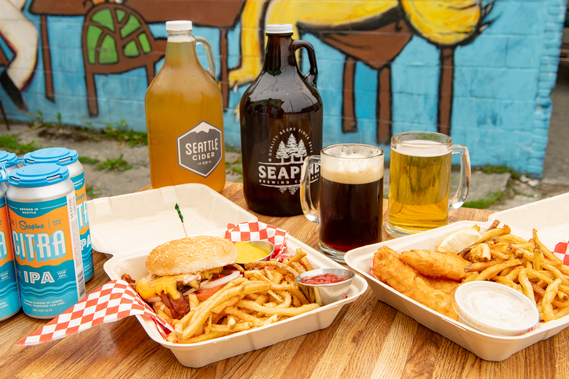 Growlers from Seattle Cider and Seapine Brewing with burger and fish & chips